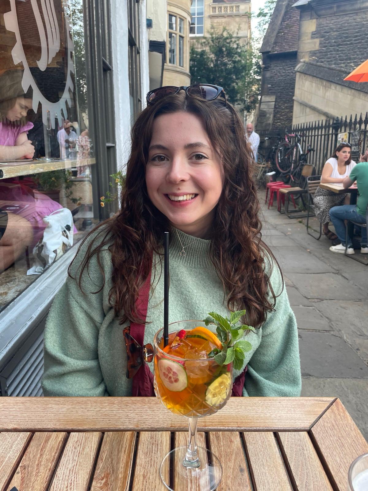 picture of holly drinking with a cocktail